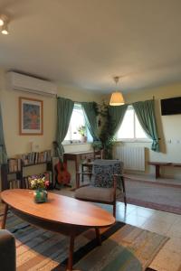 a living room with a coffee table and a couch at בשקט שלך in Mattat