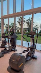 a gym with treadmills and ellipticals in a building at La Vie on JBR in Dubai