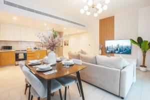 a living room with a table and a couch at La Vie on JBR in Dubai