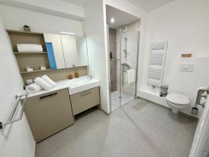 a bathroom with a sink and a toilet and a shower at DOMITYS - Les Cerfs-Volants in Berck-sur-Mer +23 photos