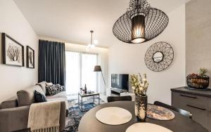a living room with a couch and a table at e-baltic - Niechorze, Your beachfront apartments, in Niechorze