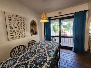 a dining room with a table and a window at Peter Pan Place in Port Edward