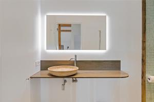 a bathroom with a sink and a mirror at HollyWad in Holwerd +4 photos