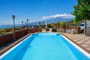 a swimming pool in a villa with a view at Sarah apartment in Taormina