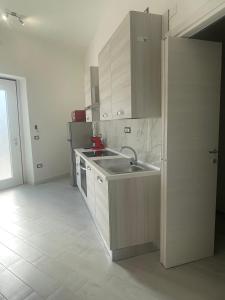 a kitchen with a sink and a counter top at Casa Vacanze Nautilus in Termoli