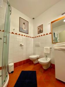 a bathroom with a toilet and a sink at Lake Veronika in Bled
