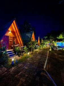 a group of houses at night with lights at Nilaveli Sheen Coast in Trincomalee