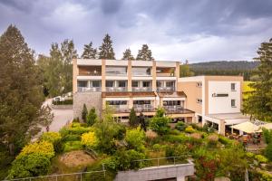 an aerial view of a building with a garden at Apartmány Star Lipno - Self Check-in in Lipno nad Vltavou