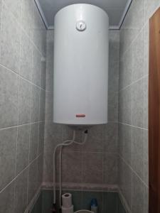 a shower with a white light in a bathroom at Three Rooms Comfort in Chişinău +16 photos