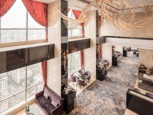 an overhead view of a lobby with chairs and tables at DoubleTree by Hilton Guangzhou in Guangzhou