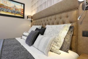 Postel nebo postele na pokoji v ubytování Capricci Romani