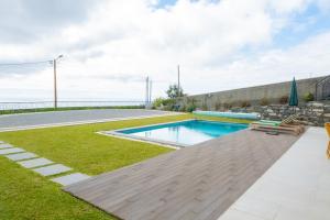a swimming pool in the yard of a house at Ponta do Pargo Village - By WeHostMadeira in Ponta do Pargo