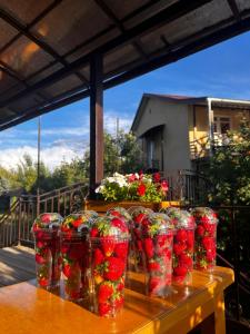 a group of red cups sitting on a table at Reina-Kench in Kunduy