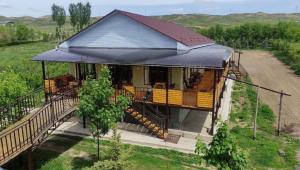 an aerial view of a house with a balcony at Reina-Kench in Kunduy