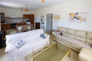 a living room with a couch and a glass table at Villa Brig in Ramljane