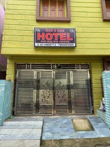 a yellow building with a hotel sign on it at Das & Das Hotel in Bhubaneshwar