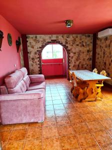 a living room with a couch and a table at las flores in Almuñécar