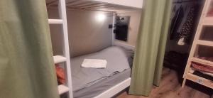 a small bedroom with a bed in a room at Inner Holiday Dolomites in Dimaro