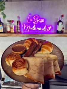 a plate of bread and pastries on a table at La Base Beach Hotel in Kiwengwa