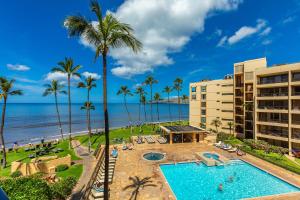 an aerial view of a resort with a swimming pool and the beach at SUGAR BEACH RESORT #412 in Kihei +30 photos
