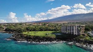 an aerial view of a resort on a island in the water at KIHEI SURFSIDE #109 in Wailea