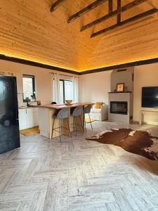 a kitchen with a table and chairs in a room at Blue Moon in Zărneşti
