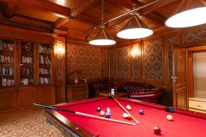 a billiard room with a red pool table at Hotel Ventus Natural & Medical Spa in Gołdap