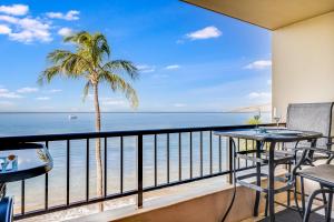 a balcony with a view of the ocean at SUGAR BEACH RESORT, #PH27 in Kihei