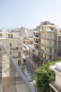 a view of a city from a balcony at Nesean Plaza Hotel in Heraklio