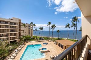 a view of the beach from the balcony of a resort at SUGAR BEACH RESORT, #409 in Kihei