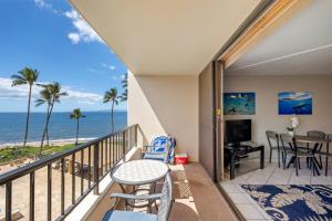 a balcony with a table and chairs and the ocean at SUGAR BEACH RESORT, #409 in Kihei +32 photos
