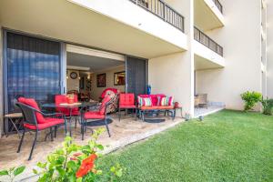 a patio with red chairs and a table at SUGAR BEACH RESORT, #131 in Kihei +38 photos