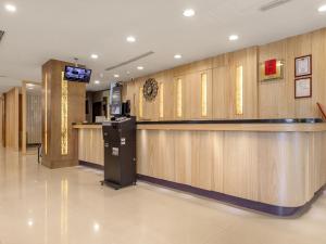 a lobby with a bar in a store at Doitsu Hotel in Taipei