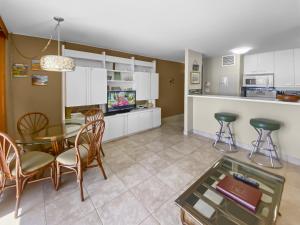 a kitchen and dining room with a table and chairs at SUGAR BEACH RESORT #125 in Kihei +29 photos