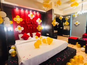 a room with a bed with yellow rubber ducks on it at Hotel The Grace Residency - Near Hotel Hyatt ,DLF MyPad, Gomtinagar, Lucknow in Lucknow +37 photos