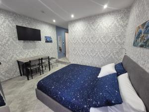 a bedroom with a bed and a dining table at B&B Monviso in Casavecchie