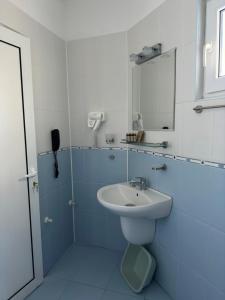 a bathroom with a sink and a mirror at Satmar in Lozenets