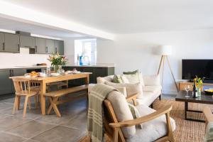 a living room with a couch and a table at The Store in Salcombe