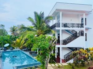 an image of a building with a swimming pool at Shine Wave Turtle Beach in Tangalle