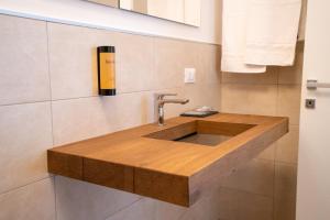 a bathroom with a wooden sink in the wall at Agriturismo Fontanavecchia in Torrecuso +7 photos