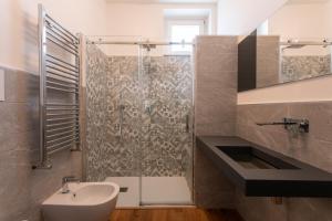 a bathroom with a shower and a sink and a toilet at Agriturismo Fontanavecchia in Torrecuso