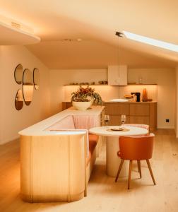 a kitchen and dining room with a table and chairs at La Venta de Bodegas Ostatu in Samaniego +28 photos