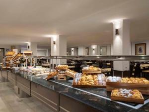 a bakery with a lot of different types of bread at Ona Marinas de Nerja Spa Resort in Nerja