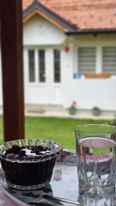 a bowl and a glass sitting on top of a table at Verina kuća in Kosjeric