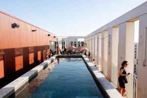 a swimming pool on the side of a building at JOST Hôtel Bordeaux Centre Gare Saint Jean in Bordeaux +97 photos
