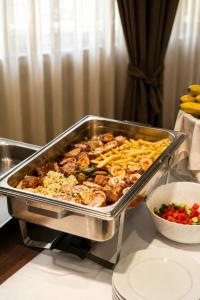 a tray of food on a table next to a bowl of food at Picikato Rooms in Krapina +25 photos
