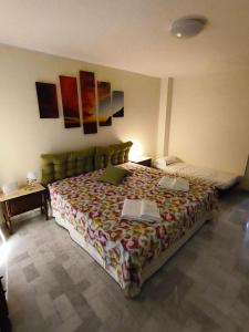 a bedroom with a bed with two laptops on it at Franca la Sarta House in Castellana Grotte +52 photos