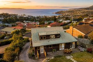 an aerial view of a house in a residential neighbourhood at Ocean Views 20kms from CBD Sleeps 10 in Kingston Beach +24 photos