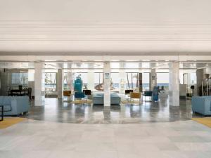 a lobby with couches and chairs in a building at Ona Marinas de Nerja Spa Resort in Nerja +48 photos