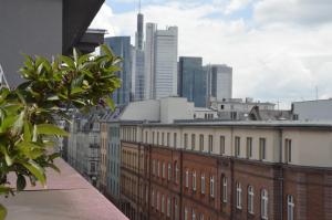 a view of a city skyline with tall buildings at Tante ALMA Bristol Hotel in Frankfurt